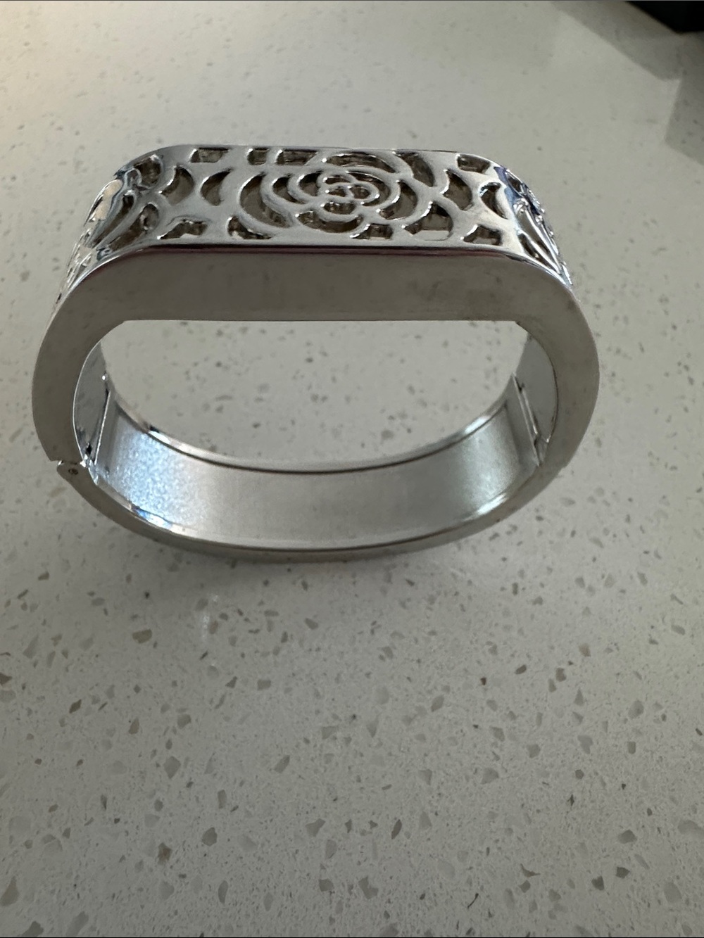 Silver Floral Cutout Hinged Bangle Bracelet designed to hide Fitbit Tracker